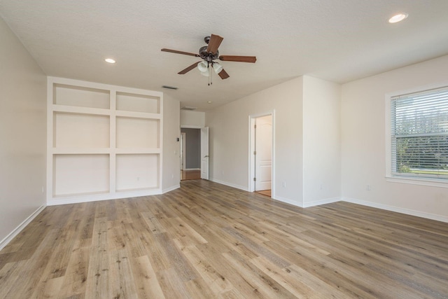 interior space with recessed lighting, visible vents, baseboards, and wood finished floors