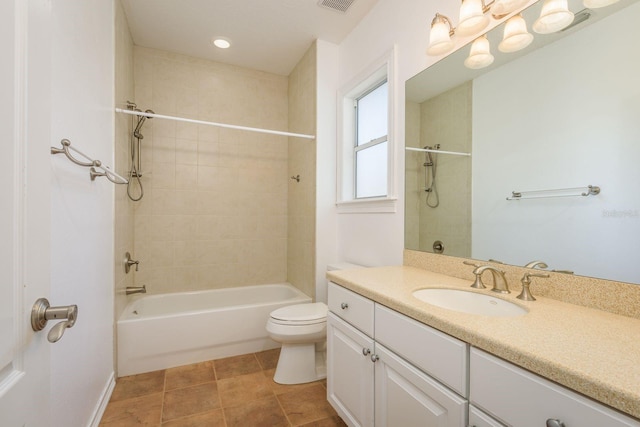 full bath featuring bathing tub / shower combination, visible vents, toilet, vanity, and tile patterned flooring