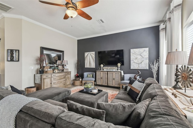 living room with ceiling fan, ornamental molding, and wood-type flooring