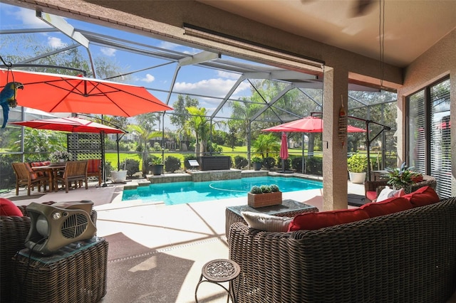 view of swimming pool with a patio, an outdoor hangout area, and glass enclosure