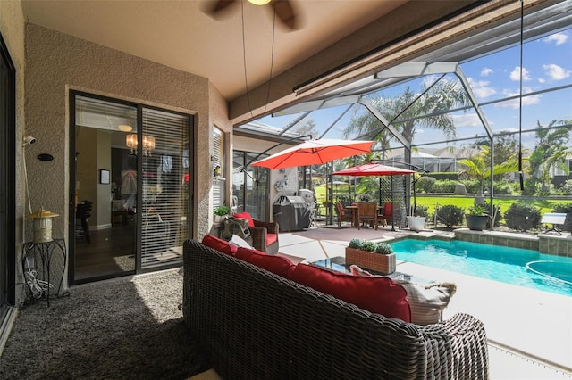 exterior space featuring outdoor lounge area, a grill, and glass enclosure