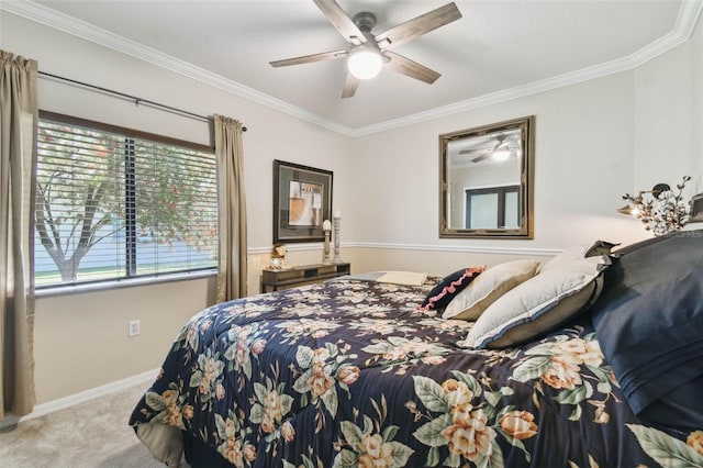 carpeted bedroom featuring a ceiling fan, crown molding, and baseboards