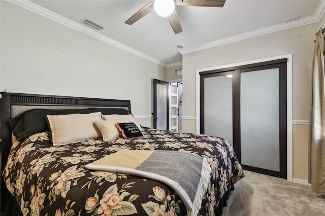 bedroom featuring visible vents, crown molding, carpet floors, and a closet