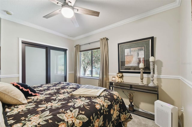 bedroom with ornamental molding and ceiling fan