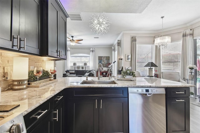 kitchen with a sink, visible vents, crown molding, and dishwasher