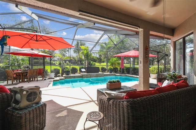 pool with a patio, outdoor lounge area, and glass enclosure