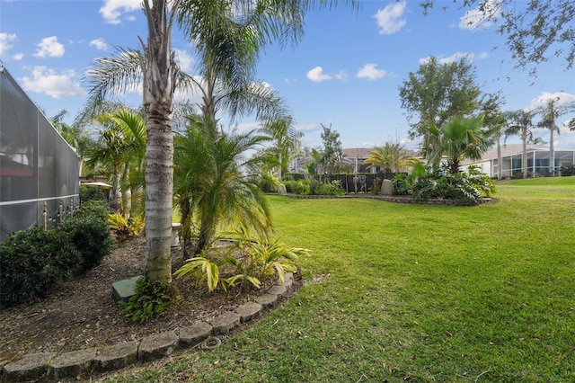 view of yard with a lanai