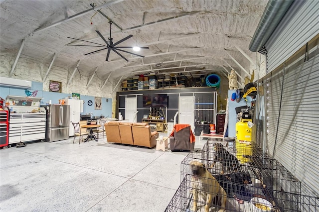 13215 Seminole Trl, Wimauma, FL 33598 - garage featuring an AC wall unit and stainless steel refrigerator