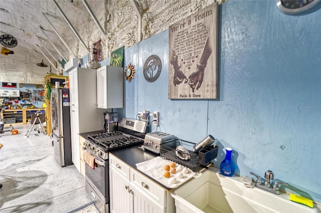 13215 Seminole Trl, Wimauma, FL 33598 - kitchen featuring white cabinetry, stainless steel appliances, and sink