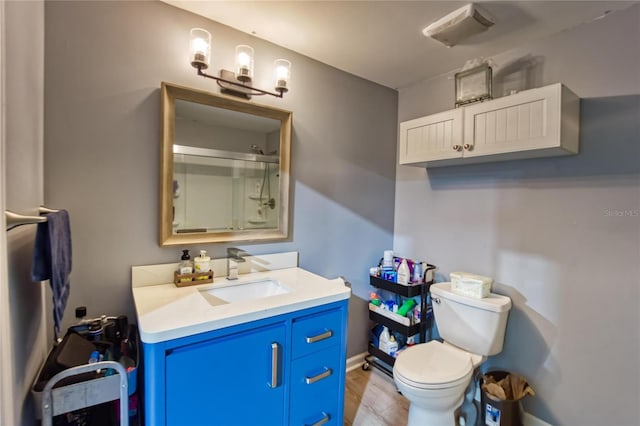 13215 Seminole Trl, Wimauma, FL 33598 - bathroom featuring walk in shower, vanity, toilet, and wood-type flooring