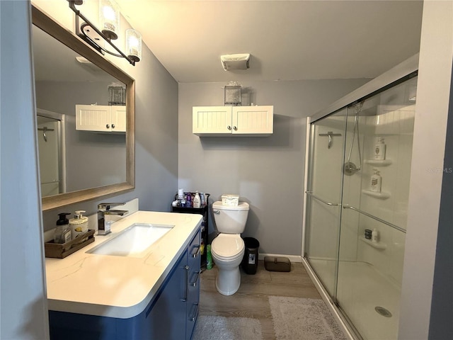 13215 Seminole Trl, Wimauma, FL 33598 - bathroom featuring vanity, wood-type flooring, toilet, and walk in shower