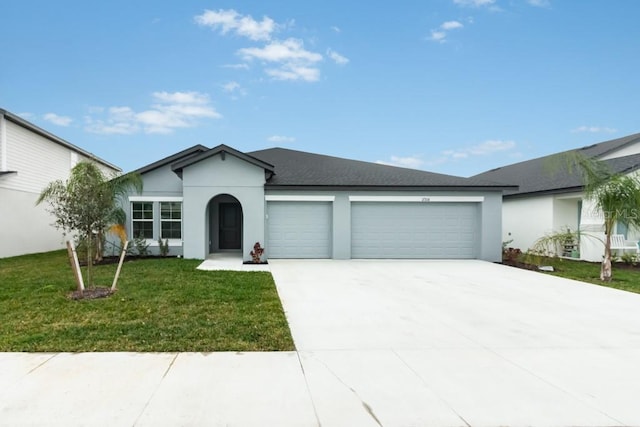 ranch-style house with a garage and a front yard