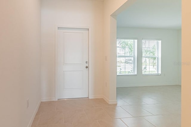 foyer entrance featuring light tile patterned flooring