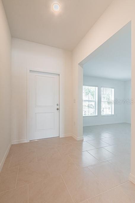 spare room with light tile patterned floors