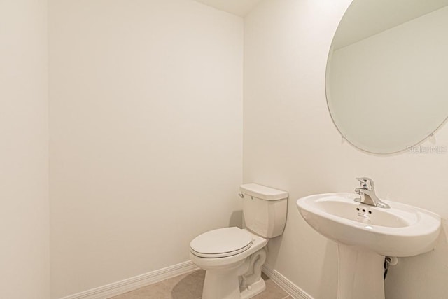 bathroom featuring tile patterned floors and toilet