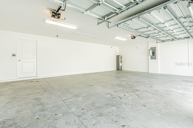 garage featuring a garage door opener, electric water heater, and electric panel