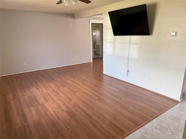 unfurnished room featuring ceiling fan and wood-type flooring