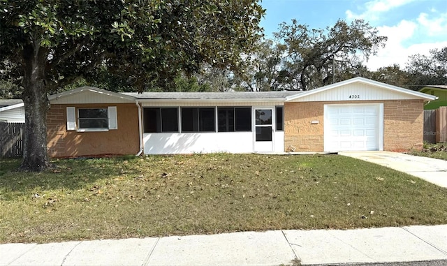 single story home featuring a garage and a front lawn