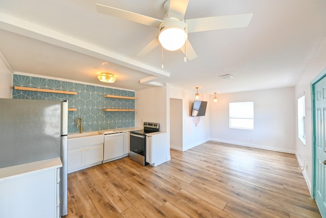 kitchen with refrigerator, white cabinetry, dishwasher, light hardwood / wood-style floors, and electric stove