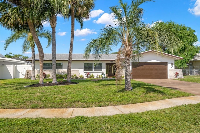 ranch-style house with a garage and a front lawn