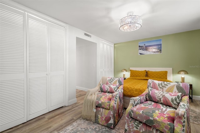 bedroom with light hardwood / wood-style floors