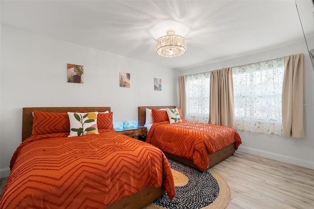 bedroom with light hardwood / wood-style floors