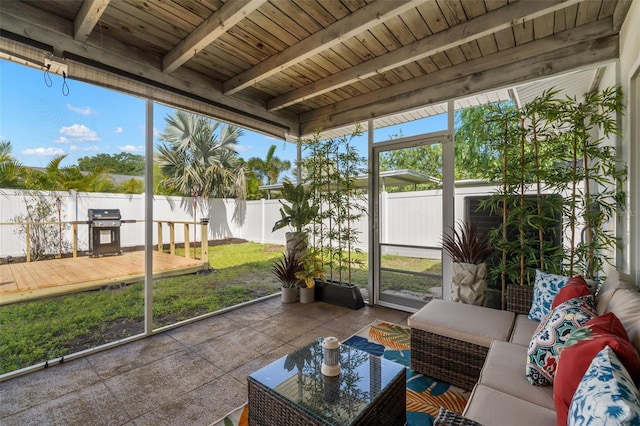 sunroom / solarium with wood ceiling and beam ceiling