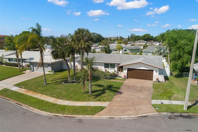 single story home with a garage and a front lawn