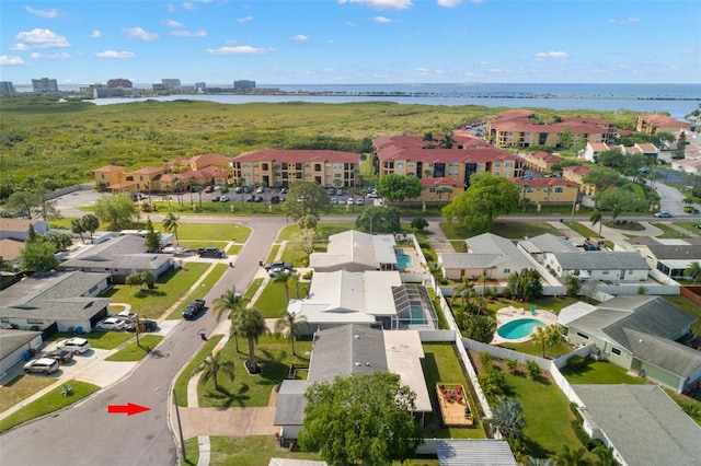 birds eye view of property featuring a water view