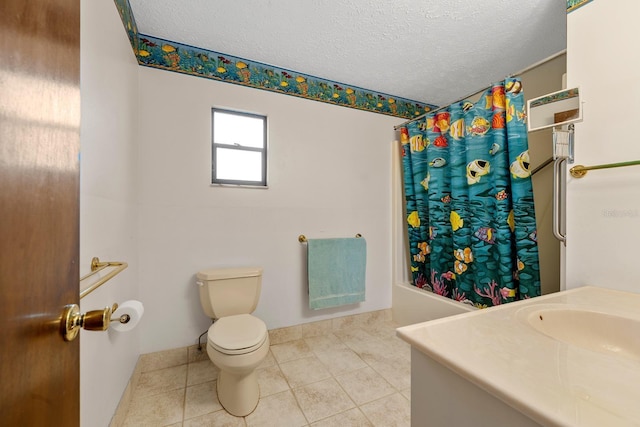 full bathroom with vanity, shower / tub combo, toilet, tile patterned floors, and a textured ceiling