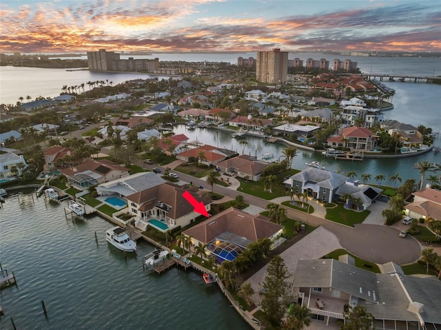 aerial view at dusk with a water view