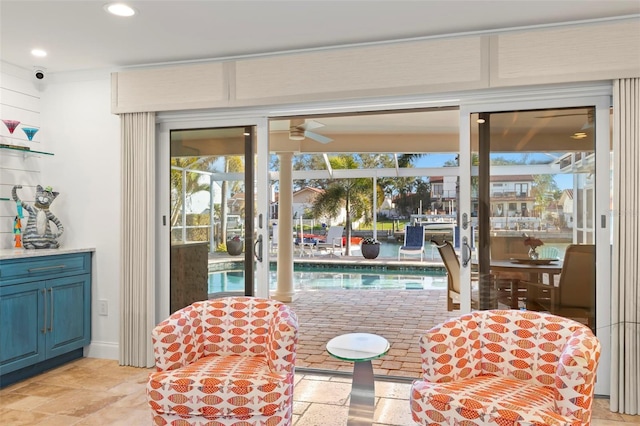 doorway featuring ceiling fan