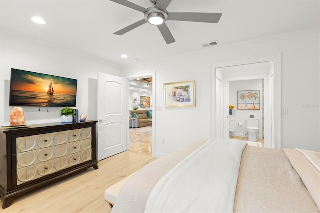 bedroom with crown molding, connected bathroom, hardwood / wood-style floors, and ceiling fan