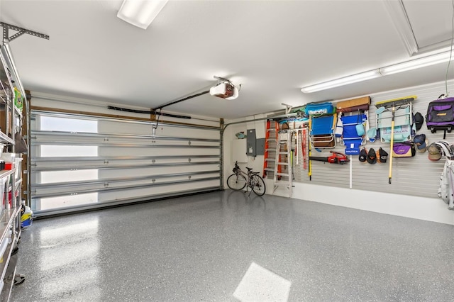 garage featuring a garage door opener and electric panel