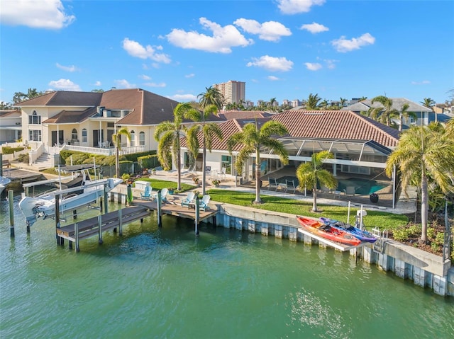 view of dock featuring a lanai and a water view