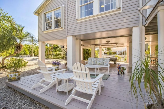 wooden terrace featuring an outdoor hangout area