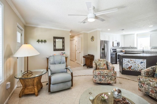 living room with crown molding, a textured ceiling, and light tile patterned flooring