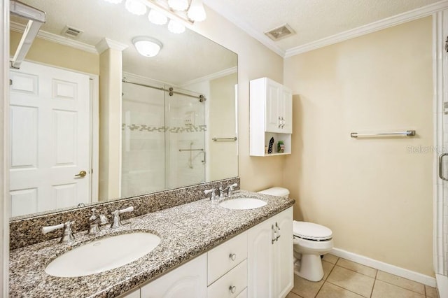 bathroom with tile patterned flooring, crown molding, a shower with door, and toilet