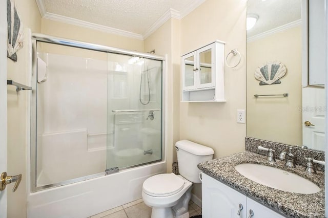 full bathroom featuring ornamental molding, combined bath / shower with glass door, vanity, and a textured ceiling