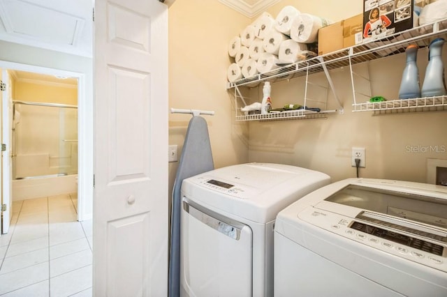 washroom featuring light tile patterned flooring and independent washer and dryer