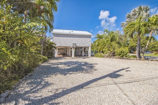 rear view of house with a carport