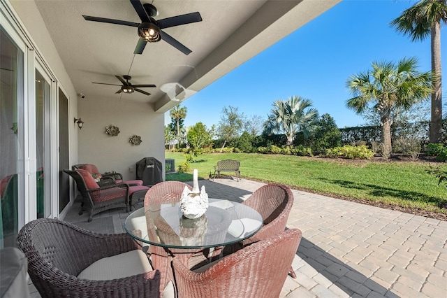 view of patio / terrace featuring ceiling fan