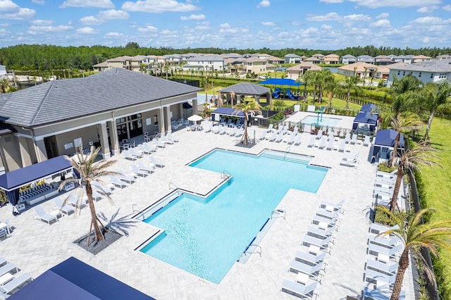 view of swimming pool with a patio area