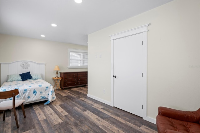 bedroom with dark wood-style floors, baseboards, and recessed lighting