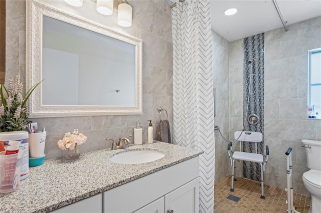 bathroom with toilet, decorative backsplash, tile walls, and vanity