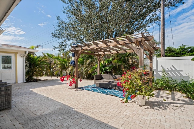 view of patio / terrace with fence and a pergola