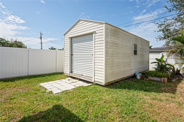 view of shed with a fenced backyard