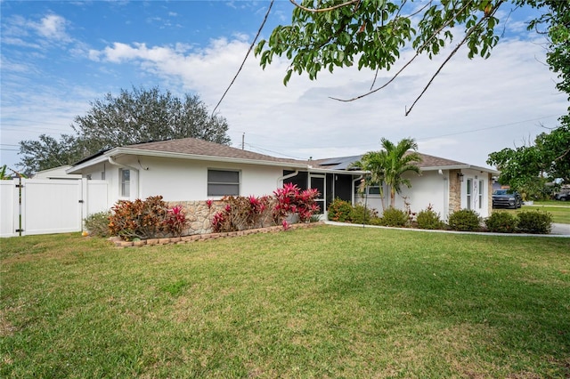 single story home featuring a front lawn, a gate, and stucco siding