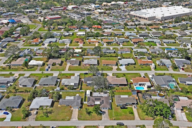 birds eye view of property with a residential view