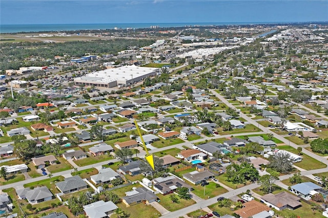 bird's eye view featuring a water view and a residential view